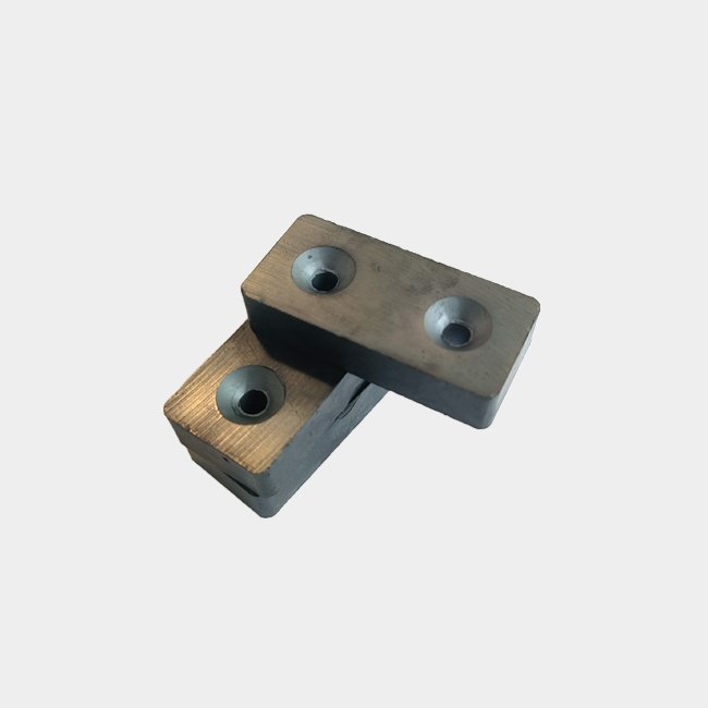 Rectangular ferrite magnet with 2 countersunk holes in stock