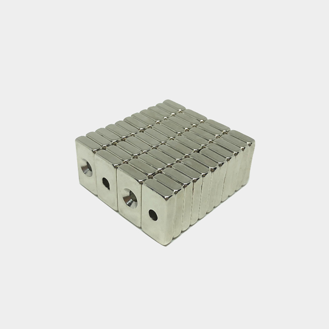 Rectangular magnet with a single screw hole in the center