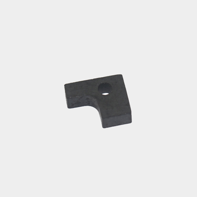 L-shaped sintered ferrite magnet with through hole