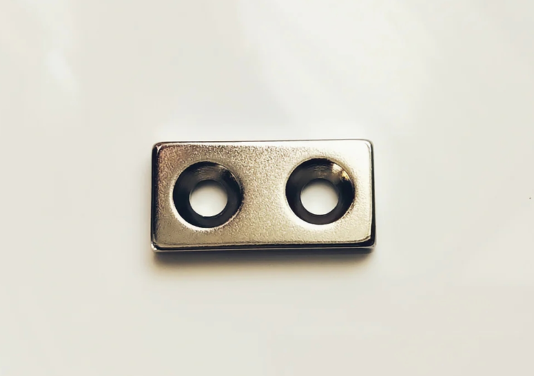 Rectangular neodymium magnet with double countersunk holes