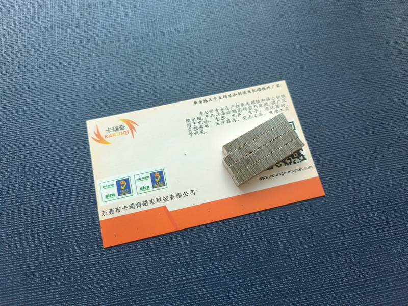 Ultra-thin, compact curved rare-earth magnets mounted on business cards